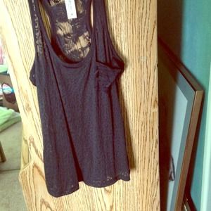 Black sheer lace top with front lace pocket detail