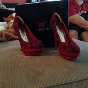 Red lace pumps