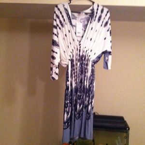 Cute cream colored dress with gray &black pattern.