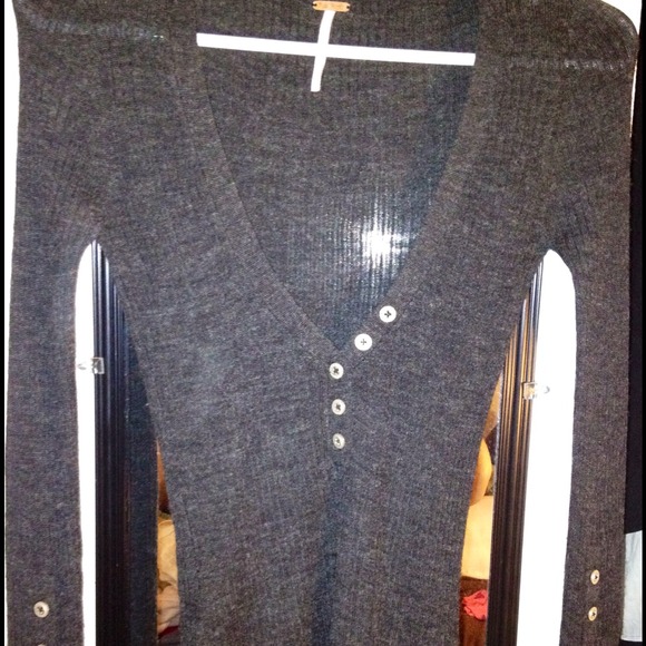 Dark grey long sleeve shirt .