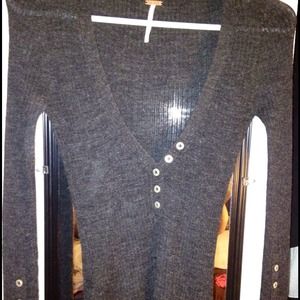 Dark grey long sleeve shirt .