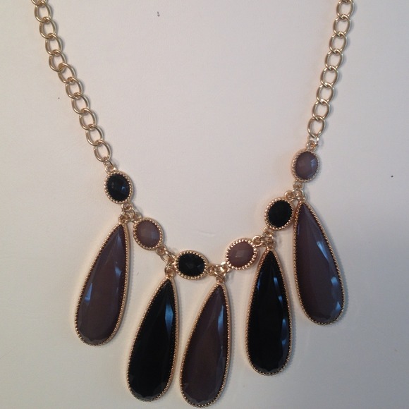 New purple stone necklace with gold chain.