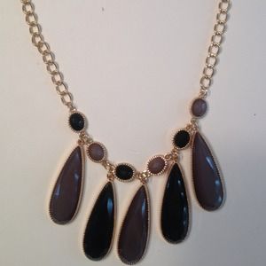 New purple stone necklace with gold chain.