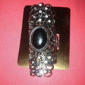 Black stone fashionable ring with clear small gems