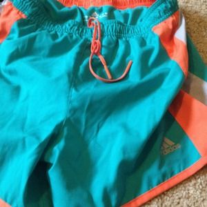 teal and orange running shorts