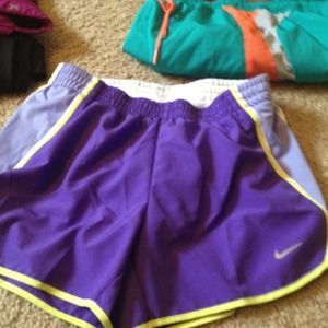 purple and yellow stripes on side/running shorts