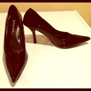Black patented pumps