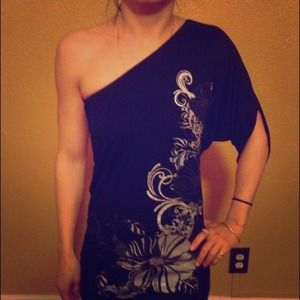 Black one shoulder top or dress.
