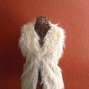 Cream color faux fur vest.