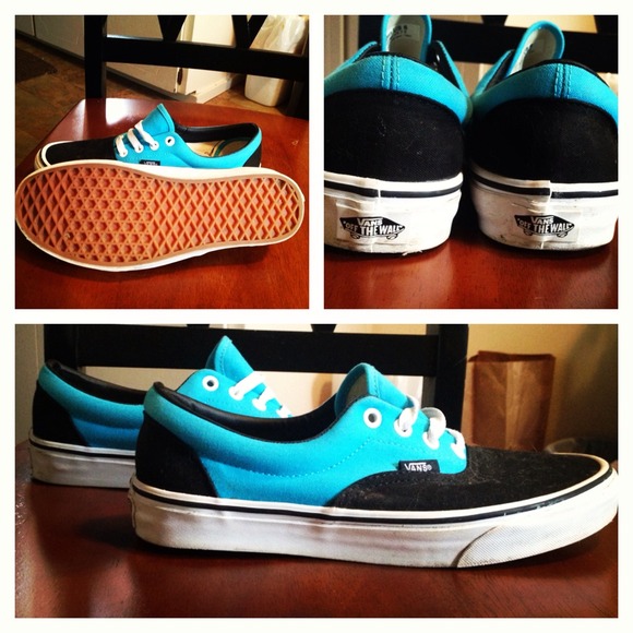 Teal and black think bottom vans with white laces.
