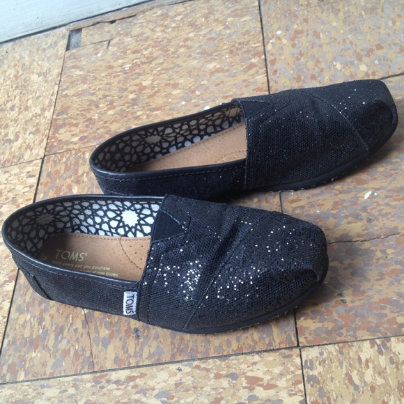 Toms black glitter flats.