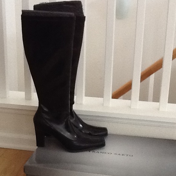 Tall black heeled boots.