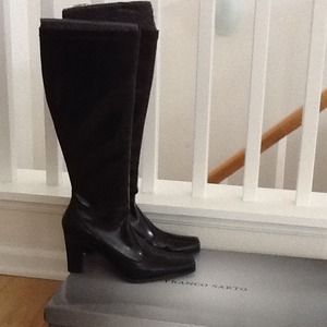 Tall black heeled boots.