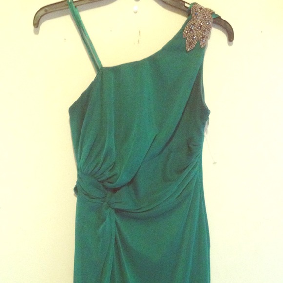Floor length one shoulder emerald green gown