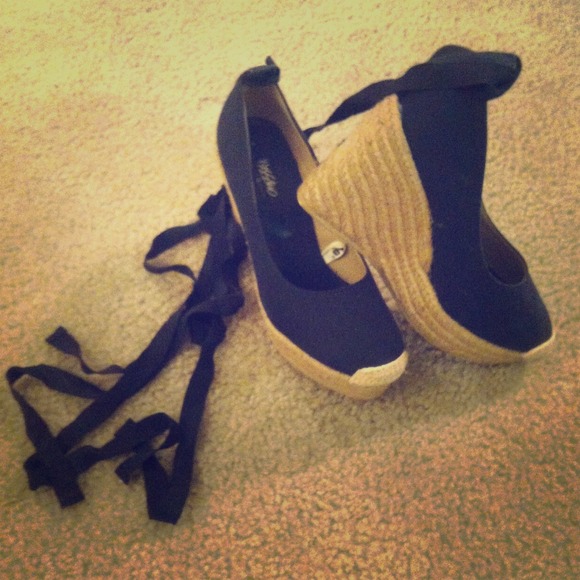 Navy blue lace up espadrilles.