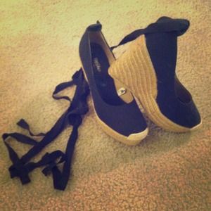 Navy blue lace up espadrilles.