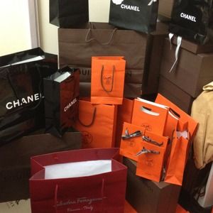 Chanel, Hermes, Ferragamo and Lv paper bags