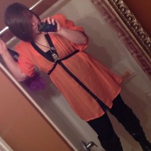 A orange and black chiffon dress.