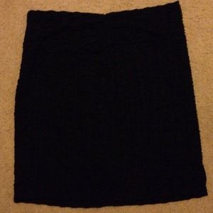 Black pencil skirt with ruche design.