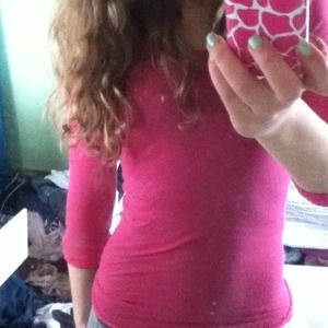 Long sleeve pink shirt.