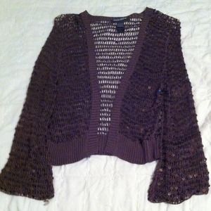 A small over jacket. It's brown with beads in it.