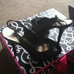 Black patent leather peep toe heels