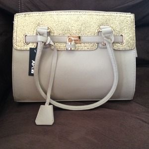 Creme colored purse with Gold glitter.