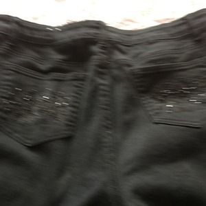Black jeans with black stones