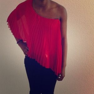 Red ruffled top. Dress up or wear with jeans.