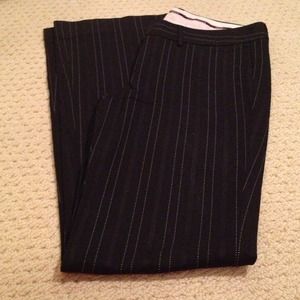 Black with white pin stripes. Limited drew fit