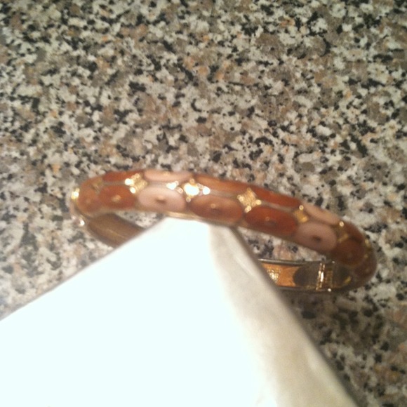 Gold bangle with peach and cream