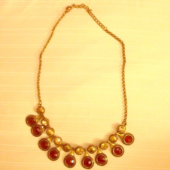 Gold and red necklace.