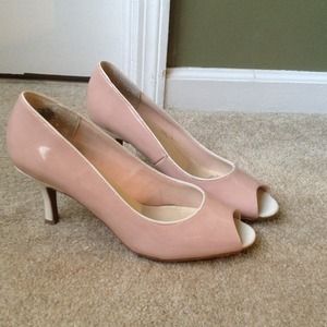 Pink toned nude peep toe heels.