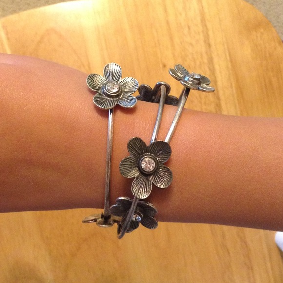 Three silver bangle bracelets.