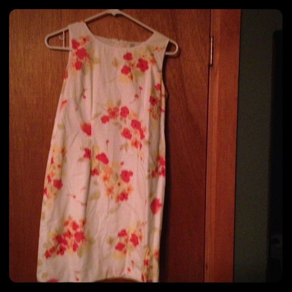 White sundress with floral print.