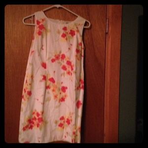 White sundress with floral print.