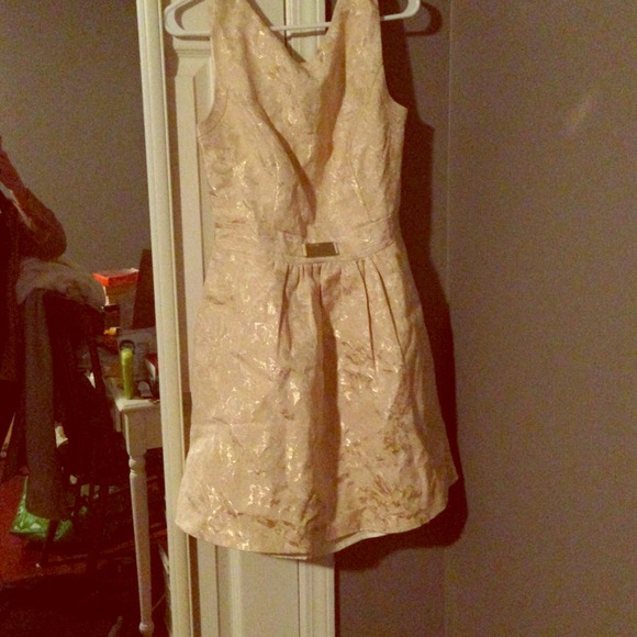 Jennifer Lopez cream and gold dress