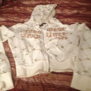 White hoodie with gold letters