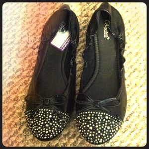 Black studded and spiked flats. Never worn.
