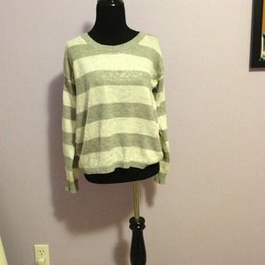 White and grey sweater.