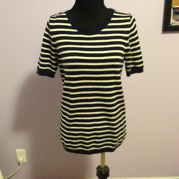 A blue and white stripes. Short sleeve sweater.