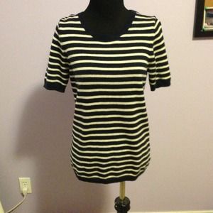 A blue and white stripes. Short sleeve sweater.