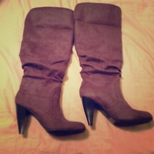 Gray fold over high heeled boots.