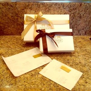 Coach gift-boxes w/ tissue paper and ribbon