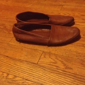 Brown minnetonka moccasins.