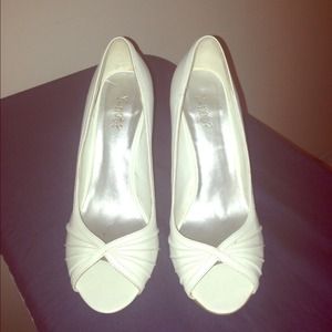Cute white open toe with beige heel.