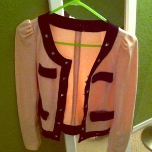 Pink sweater with studs.