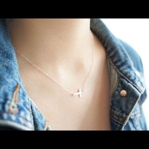 Gold sideways cross necklace by MintEli