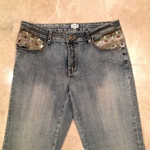 Cache jeans accented with lace and beads on waist