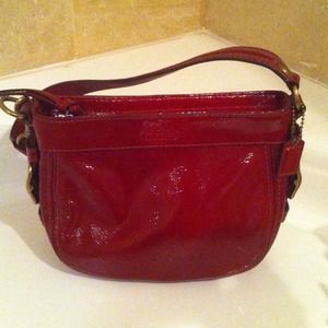 Unused, NWT Coach red patent bag.
